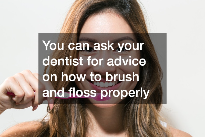 woman smiling and holding a toothbrush